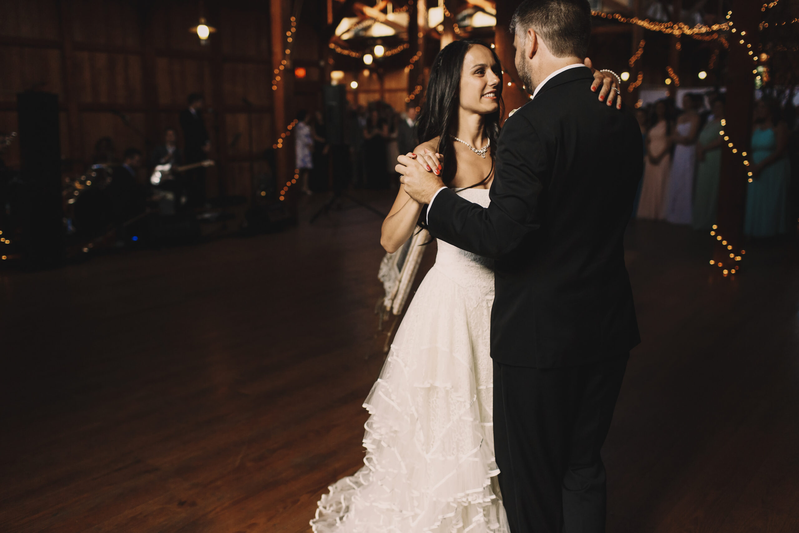 Bride and groom dancing closely together at their wedding