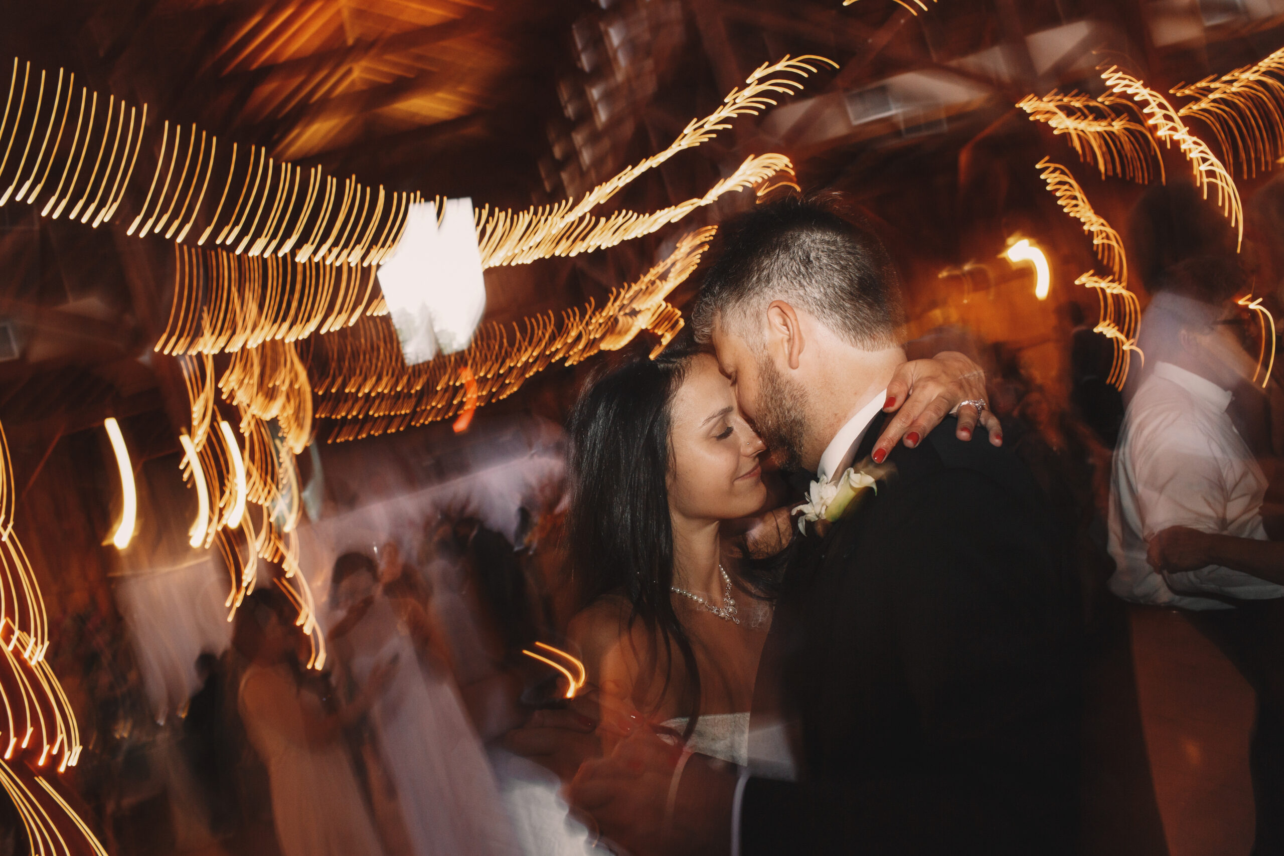 Close-up of a couple's feet and formalwear during a wedding first dance
