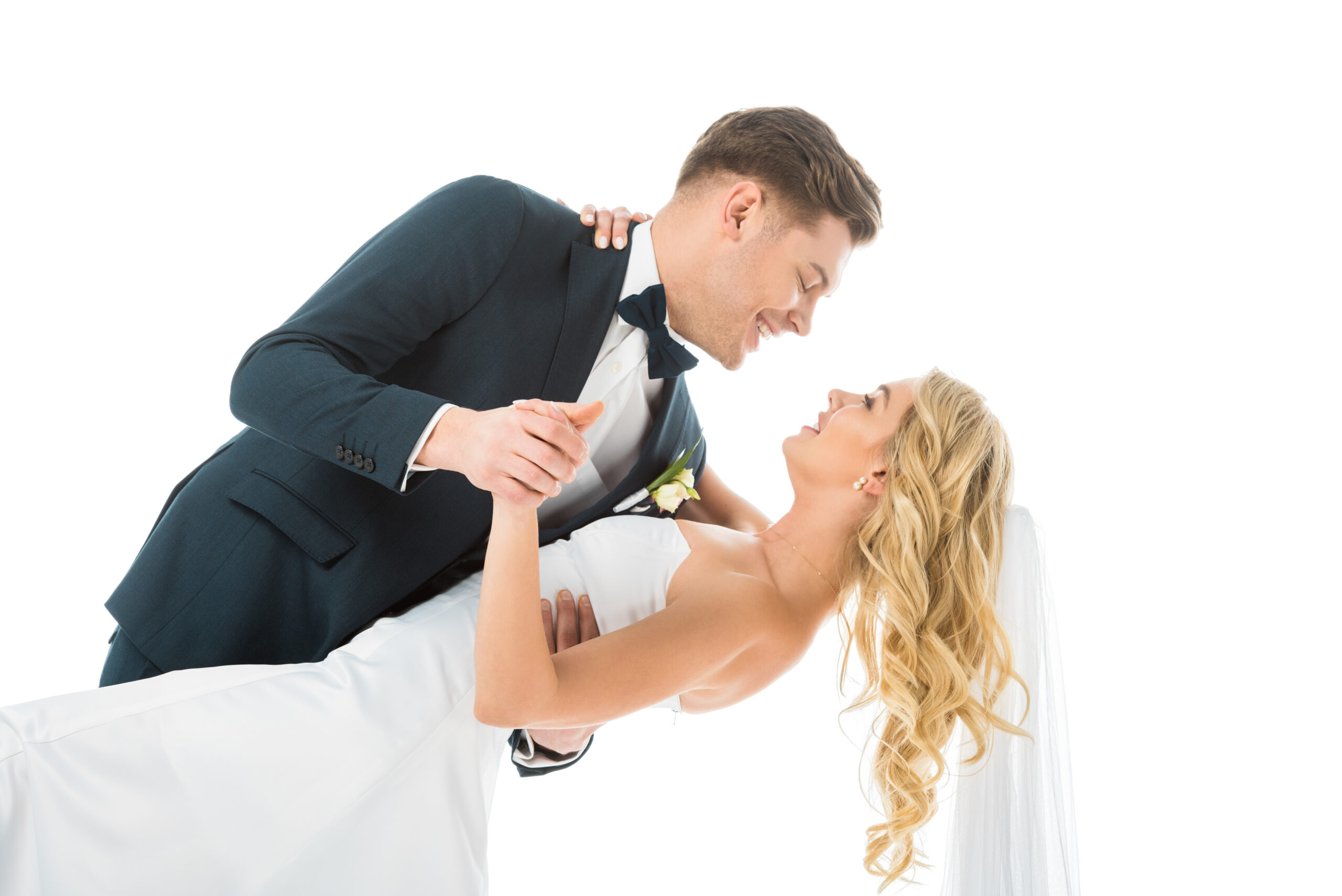 Groom smiling at his bride during a romantic wedding dance moment