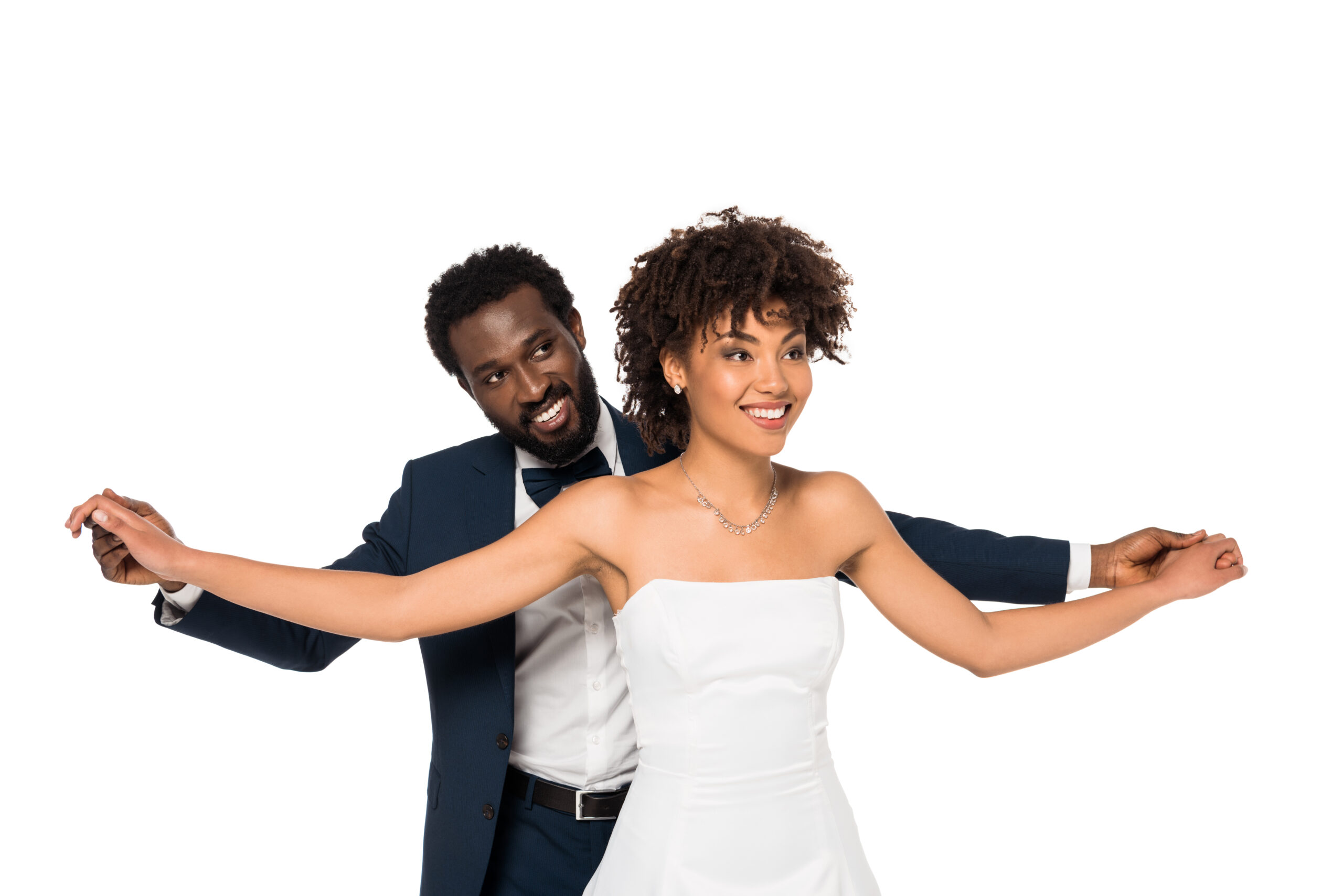 Couple embracing closely while dancing at their wedding