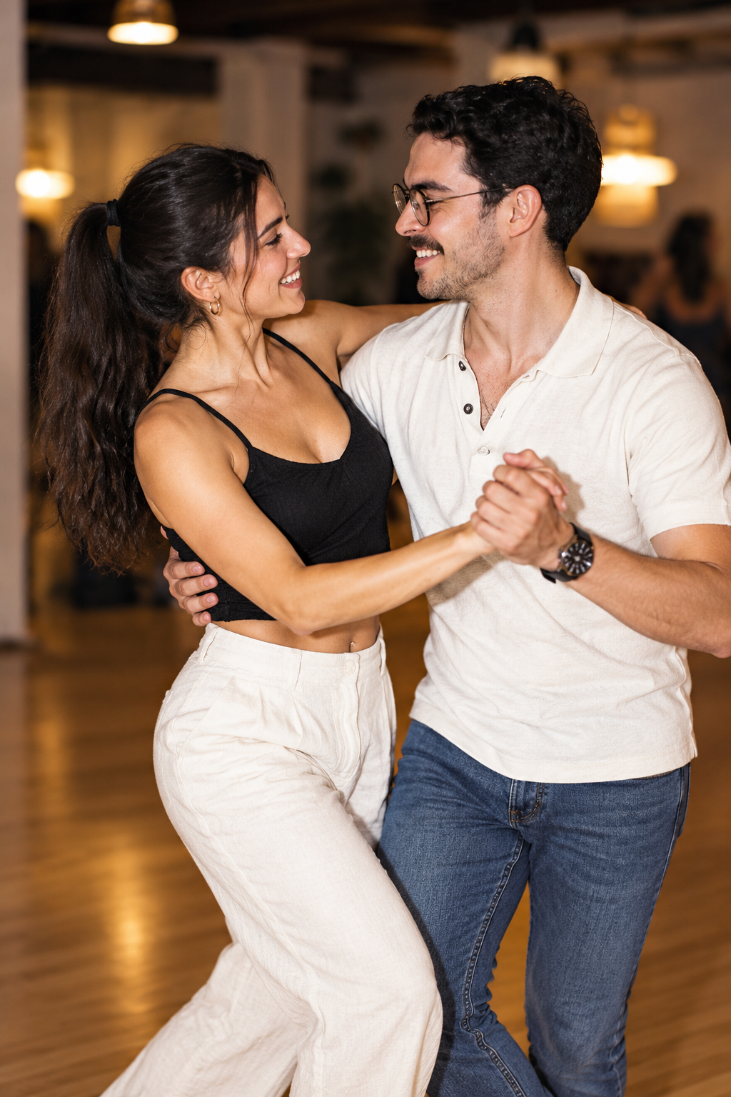 Engaged couple practicing their wedding dance hold at Beach Ballroom studio in Toronto