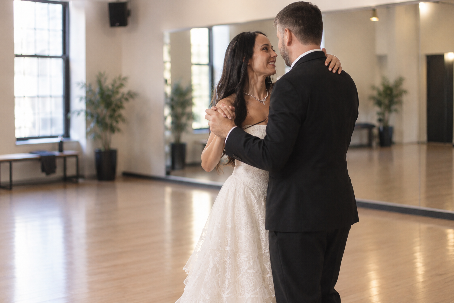 Bride and groom rehearsing their wedding first dance at Beach Ballroom studio in Toronto