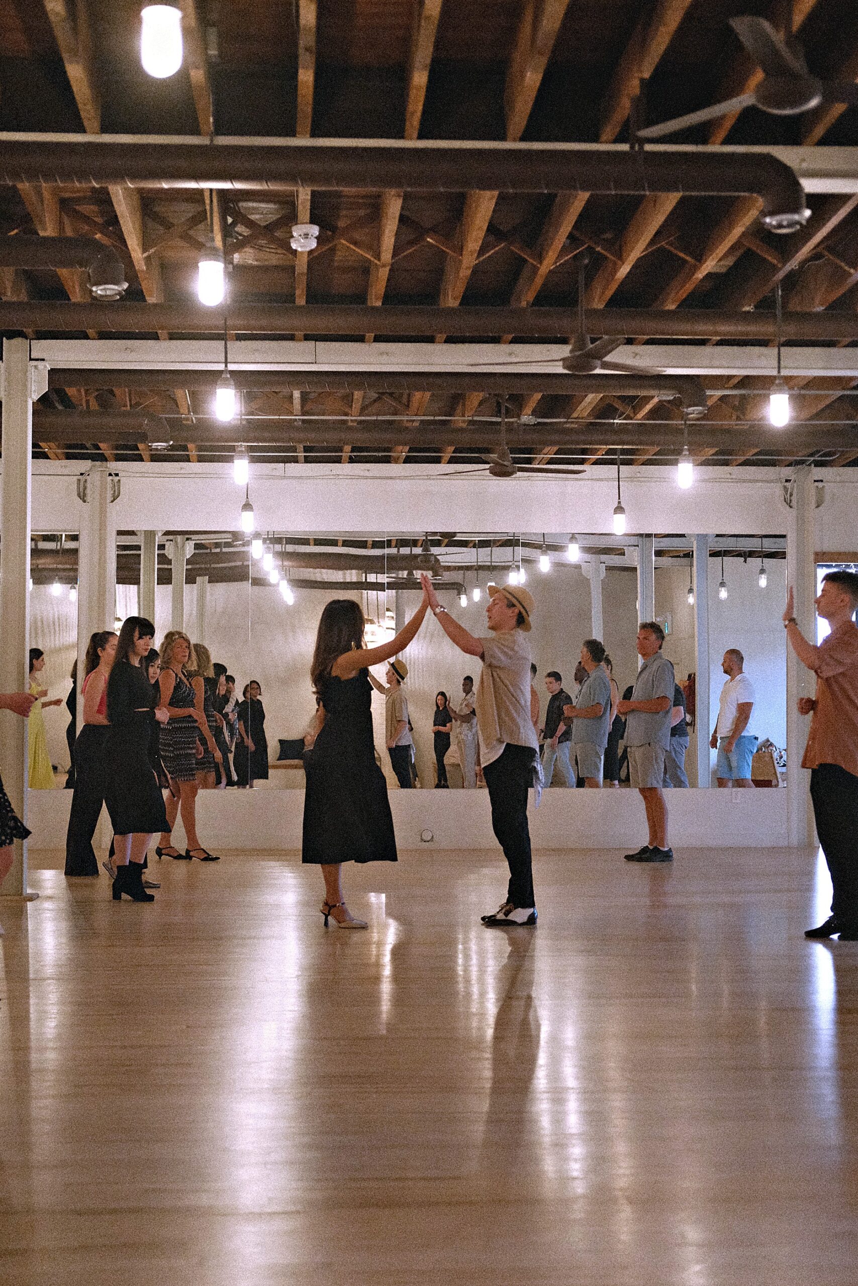 Students learning together in a beginner group dance class at Beach Ballroom Toronto