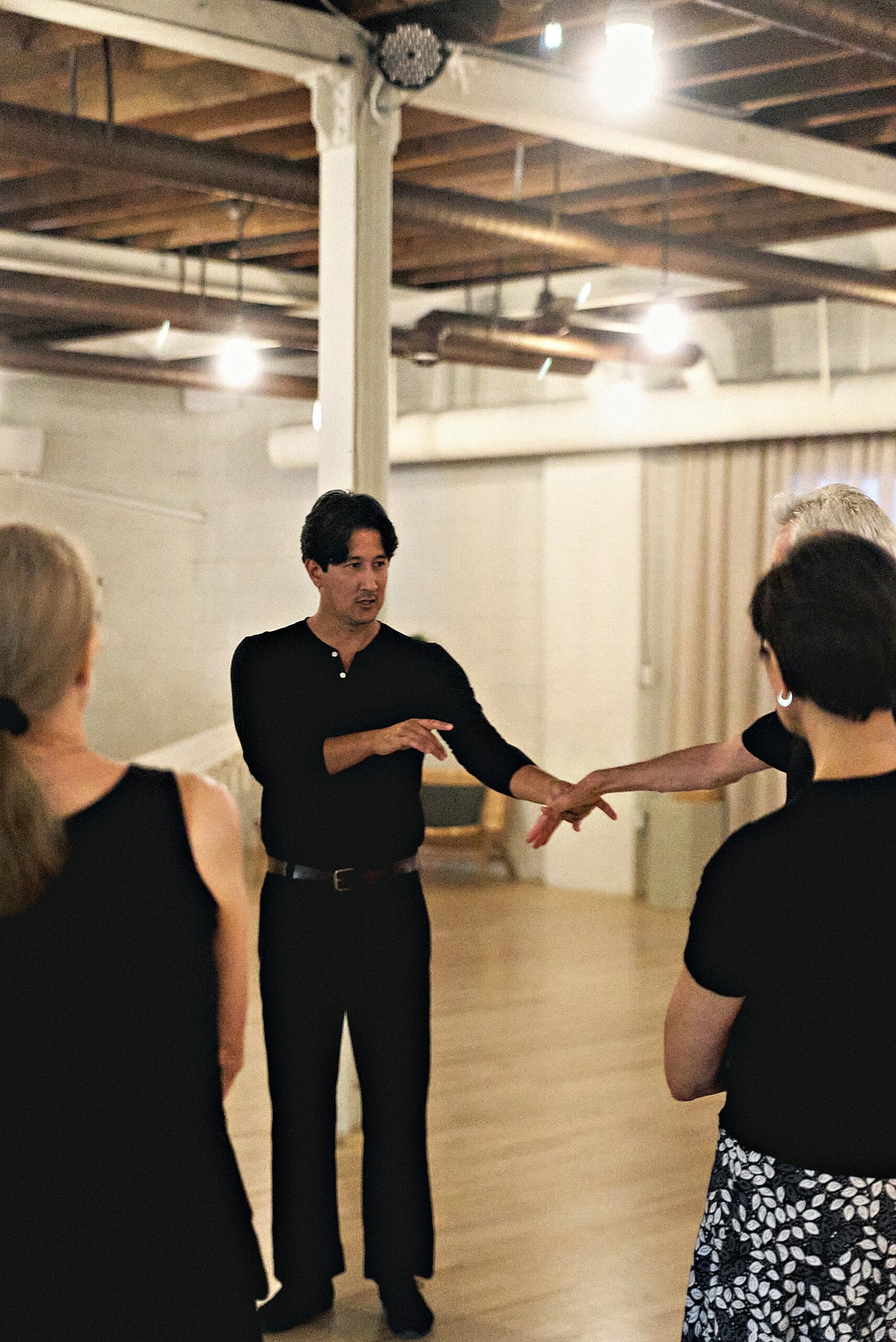 Instructor guiding a student during a private lesson at Beach Ballroom Toronto
