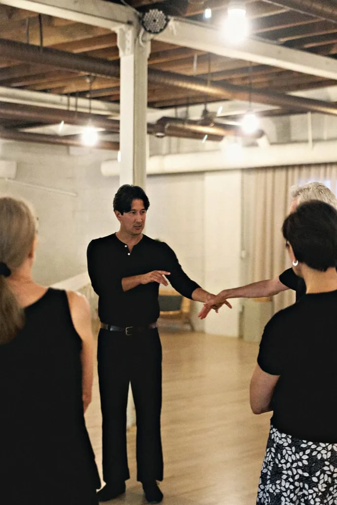 Beach Ballroom instructor coaching a student through a step during a dance lesson in Toronto